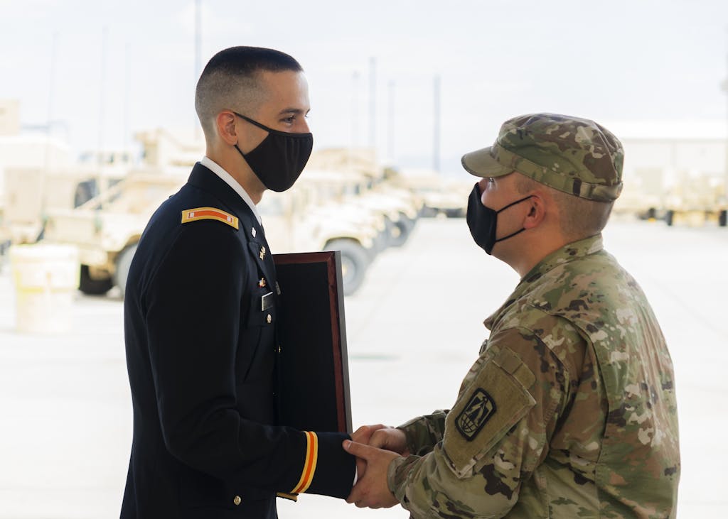 Soldier and Captain Shaking Hands at a Ceremony